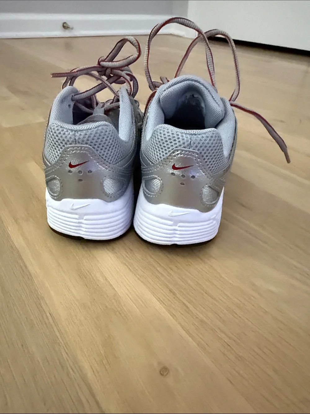 Nike Kids Silver Sneakers with Red Swoosh